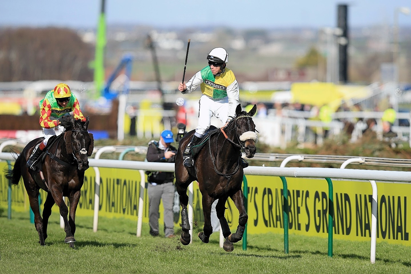 Jockey Leighton Aspell celebrates on board Many Clouds after victory in last year's Grand National