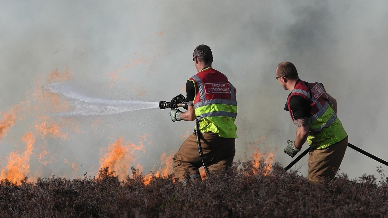 Firefighters deal with the large moorland fire