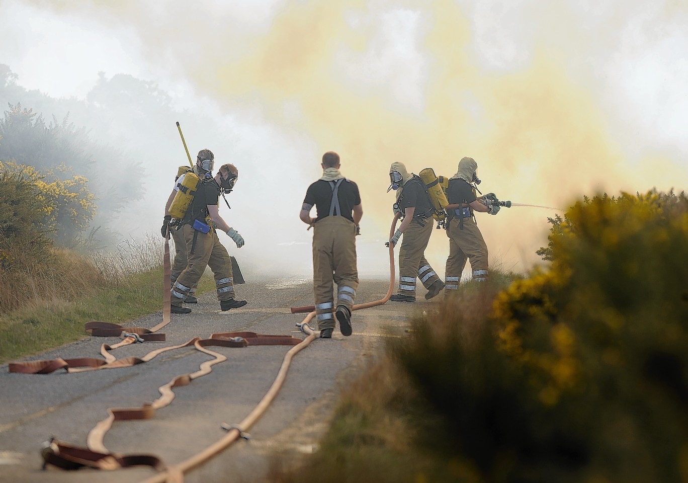Firefighters tackle the large moorland fire near Inverness