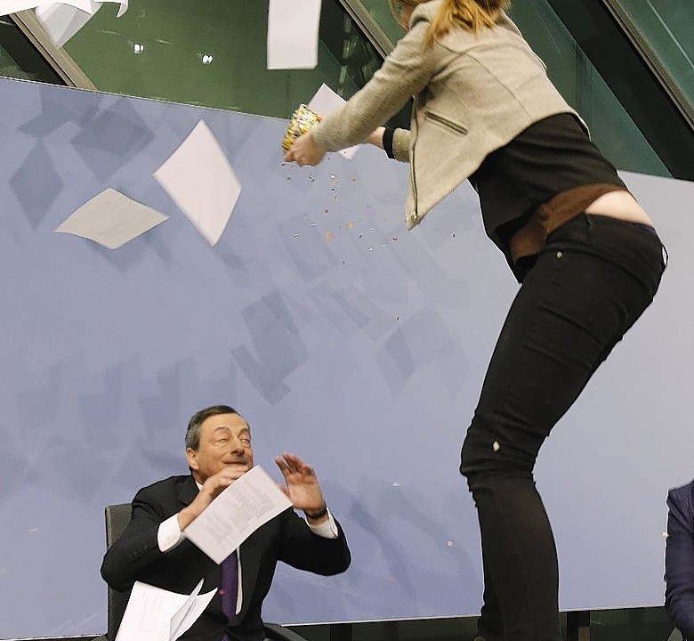 A Femen activist made her protest this morning before behind carried from the room