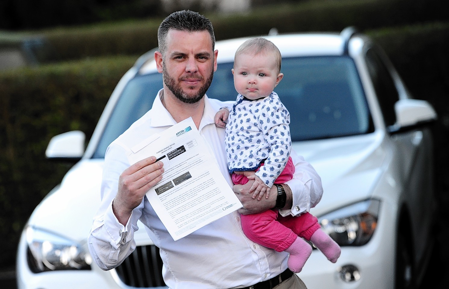 Morgan Adam with his daughter, Robin, and his fine. Picture by Kami Thomson