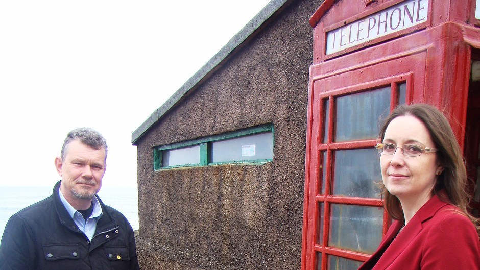 Banff and Buchan parliamentary candidate Eilidh Whiteford and Troup SNP councillor Ross Cassie at the phone box in Pennan, Aberdeenshire (SNP/PA)