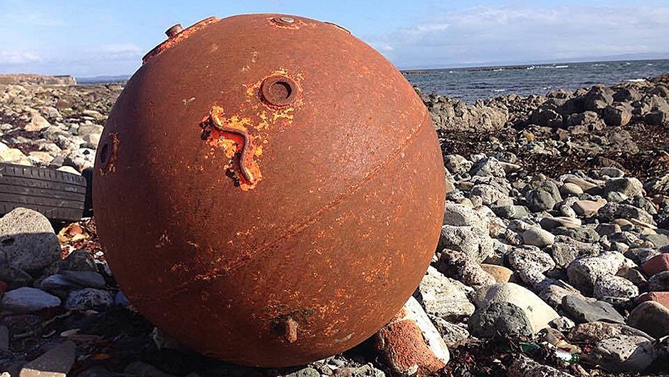 A suspected sea mine which washed up in the North Ayrshire town of Ardrossan