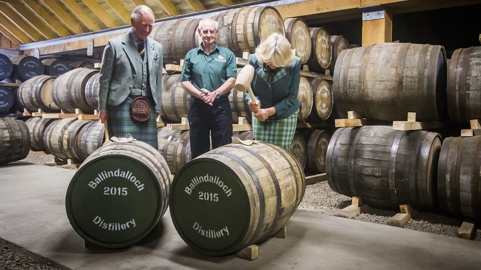 Charles and Camilla fitted bungs to two whisky casks during a visit to Ballindalloch Distillery in Aberdeenshire