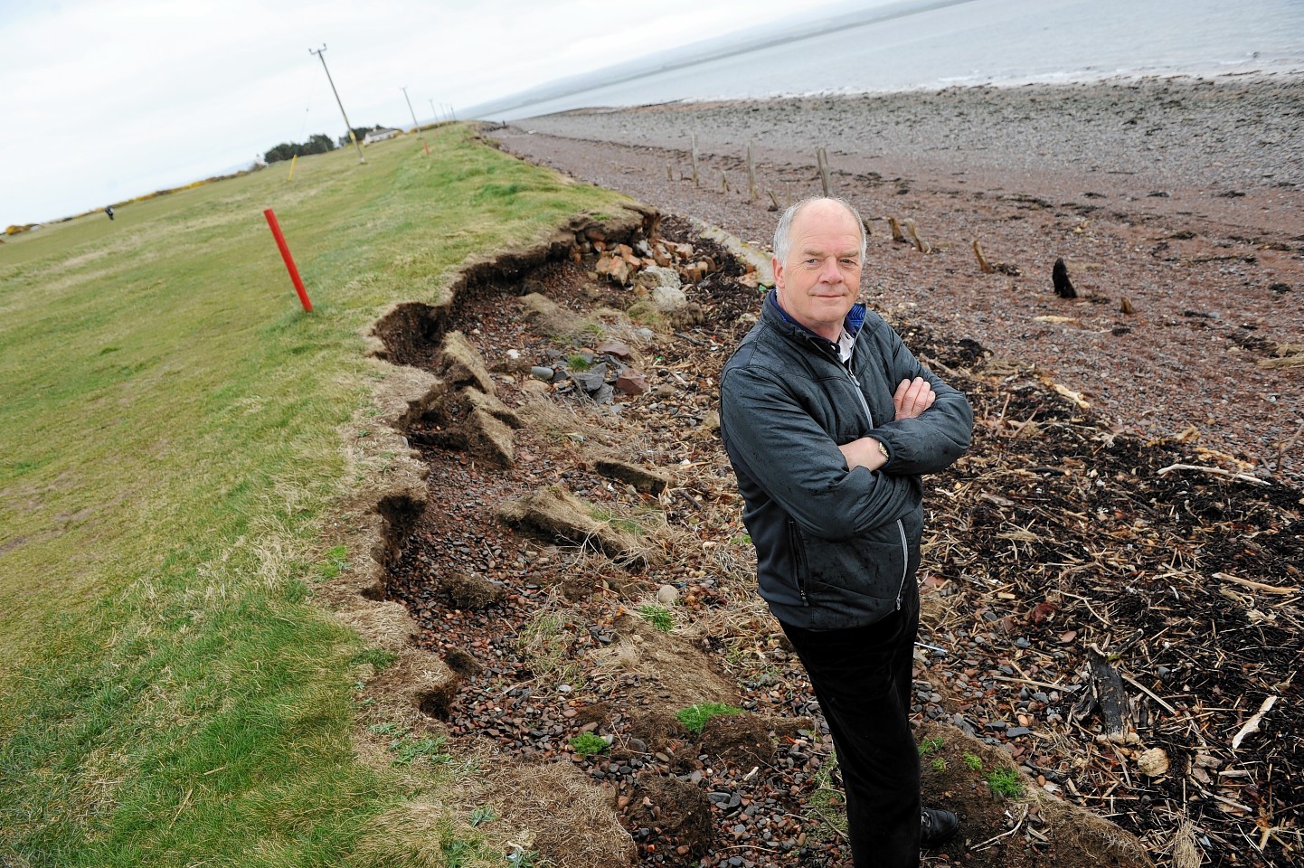 Phillip Thorn, Captain of Rosemarkie and Fortrose Golf Clubwith the erosion on the west side of the course.