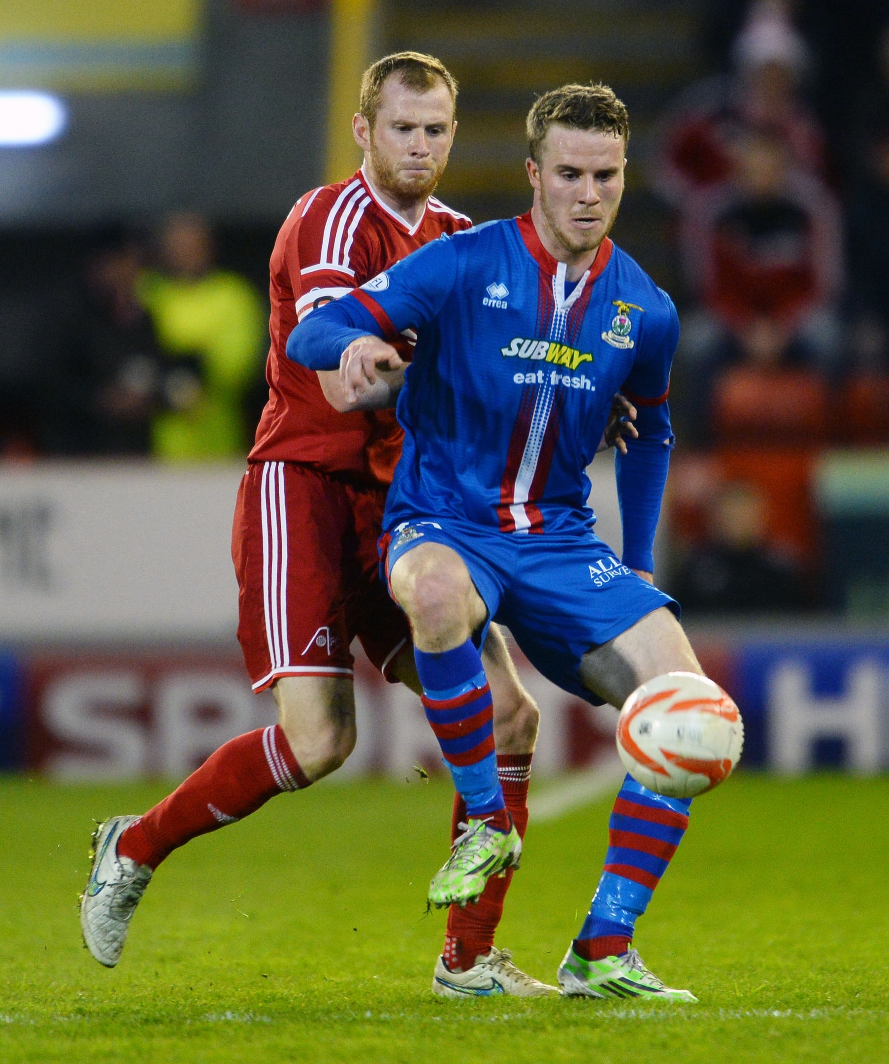 Mark Reynolds and Marley Watkins battle for the ball