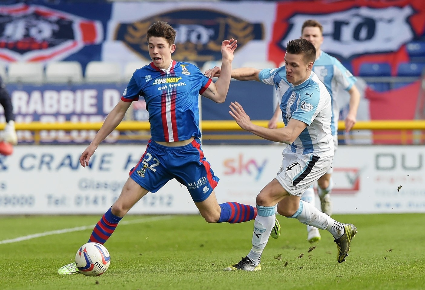 Ryan Christie escapes the clutches of Dundee defender Thomas Konrad in 2015.