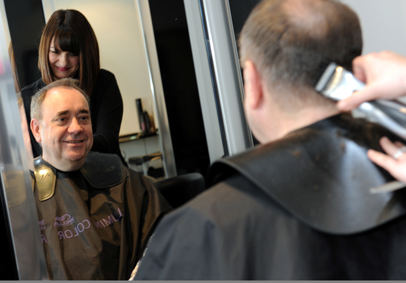 Aberdeenshire East MSP Alex Salmond receives a haircut from Siobhan Kintrea, owner of Distinction Hair Design - one of the beneficiary of the Small Business Bonus Schemes.