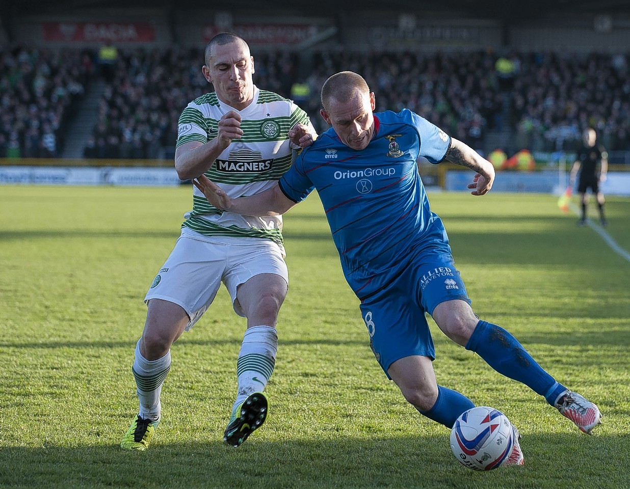 Celtic captain Scott Brown challenges Caley Thistle defender Carl Tremarco