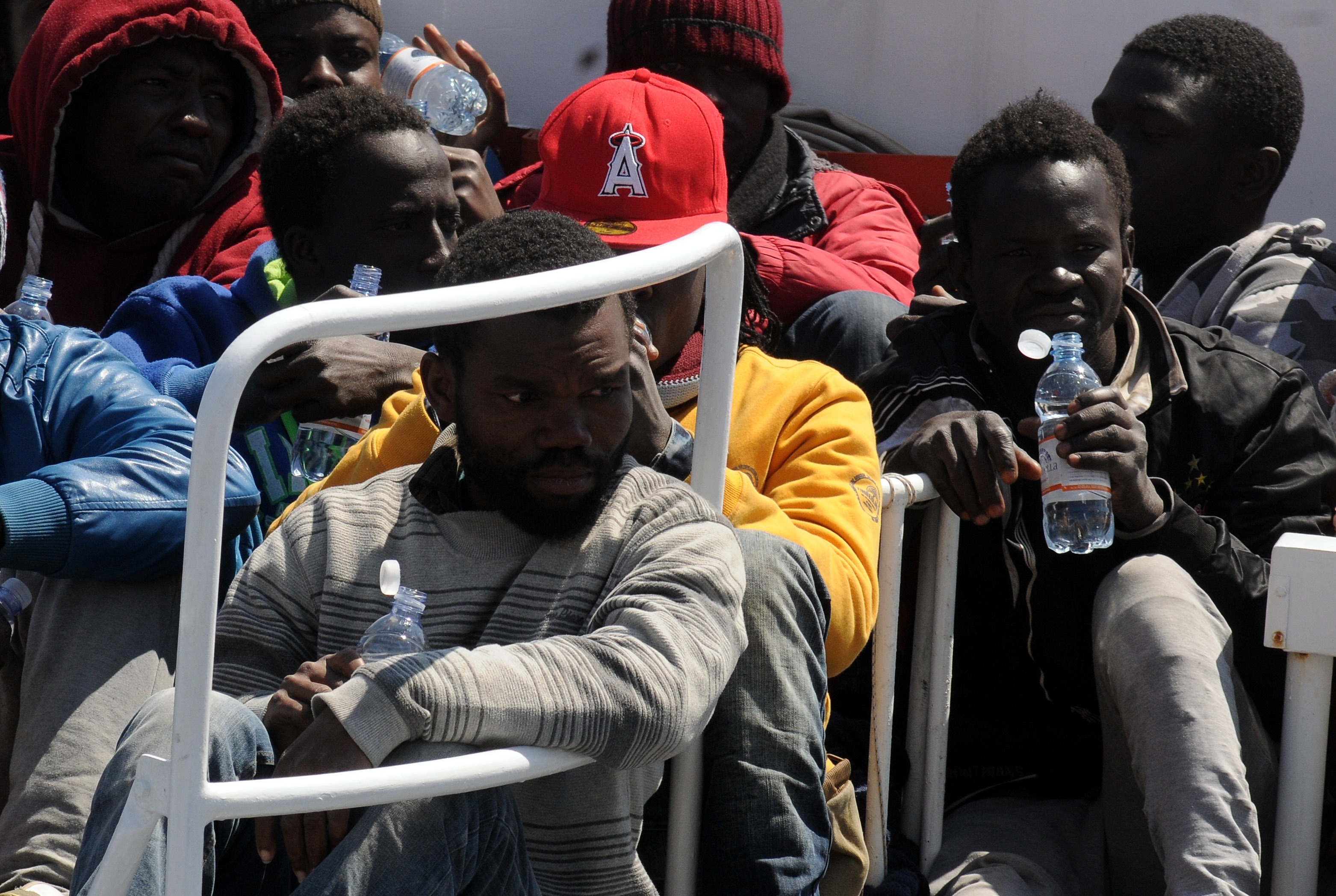 Surviving migrants arrive at Palermo's harbour, Italy, after being rescued at sea