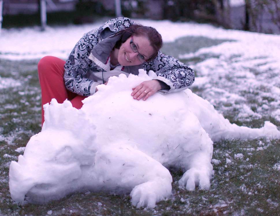 Uliana Maskymiuk  with her latest snow sculpture