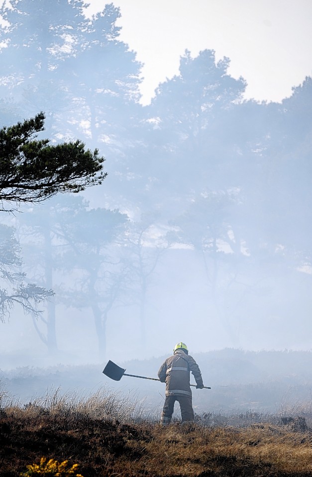 Firefighters beating out the wildfire above Dornoch