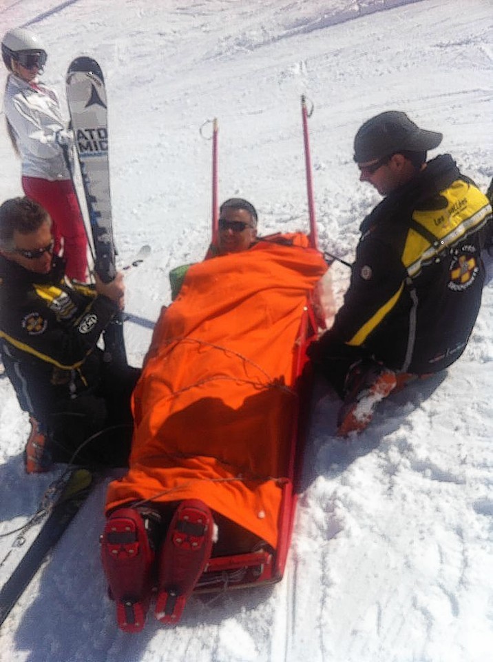 Colin Marr is taken from the slopes after injuring his shoulder