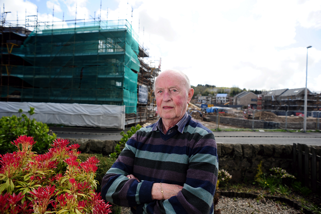 Ian Davie pictured in the front garden of his home on Muggiemoss Road