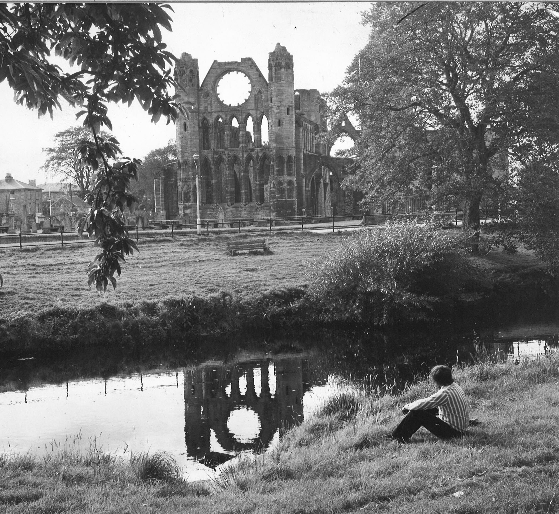 Elgin Cathedral reflects into the water, 1974