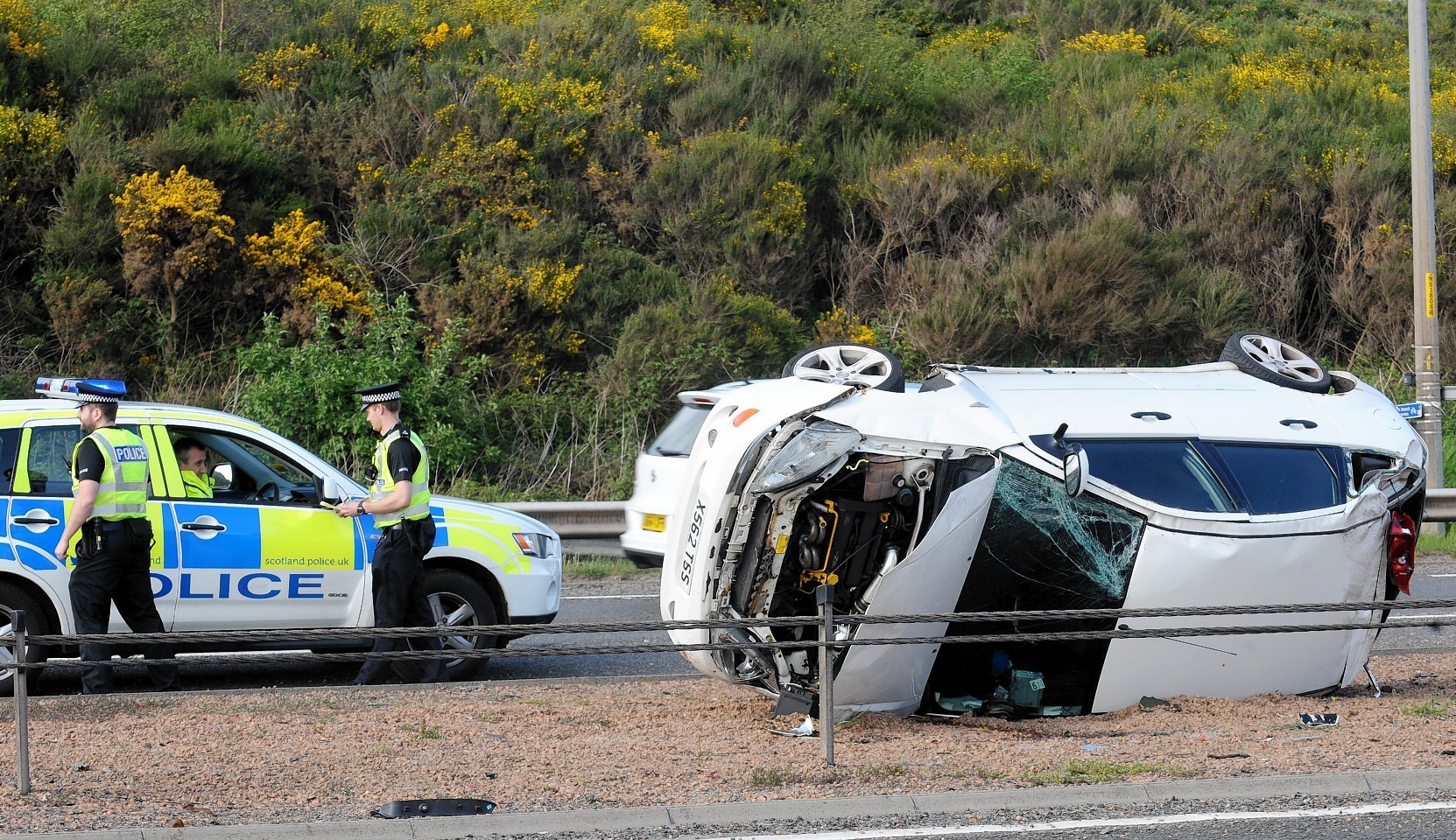 Police at the scene of  this afternoon's one car accient on the A9 at North Kessock which caused holdups for traffic in both directions during rush hour.