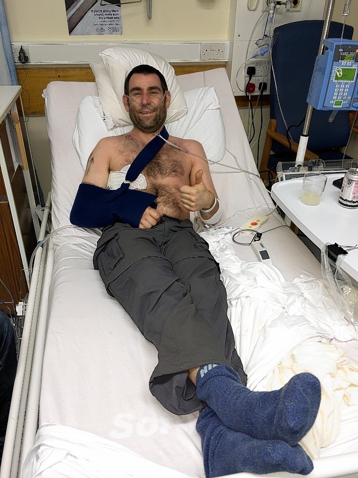 Glyn Jarvis in hospital when he hurt his arm - delaying their biking expedition