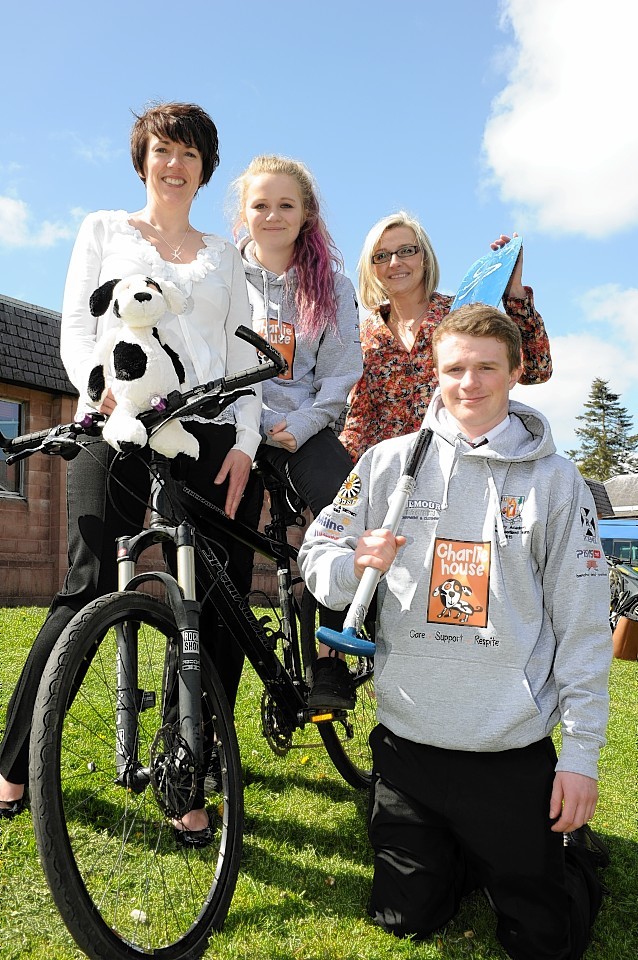 Charlie House's Tracy Johnstone and Lynn Batham with pupils Morven Douglas, 13 and Andrew Simpson, 15.
Picture by Colin Rennie