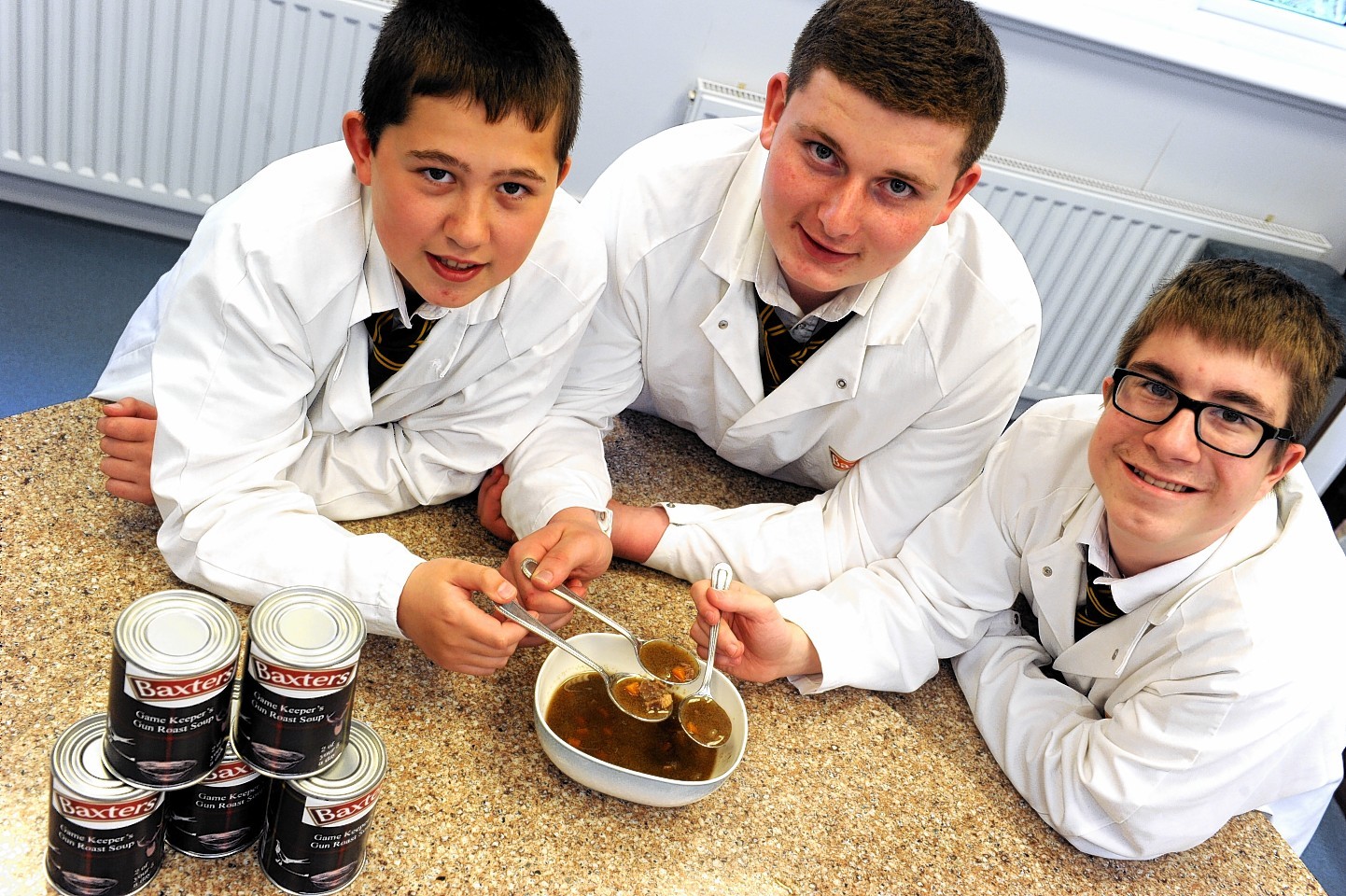 Pupils, Shaun McLeod, Euan McLean, and Christopher Gill, with the 'Gamekeeper's Gun Roast Soup'.
Picture by Gordon Lennox