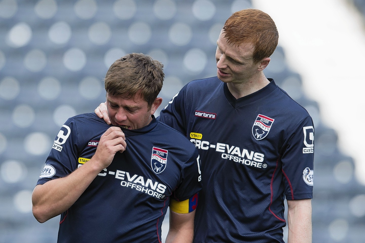 Boyd consoles Brittain following the skipper's final match for Ross County
