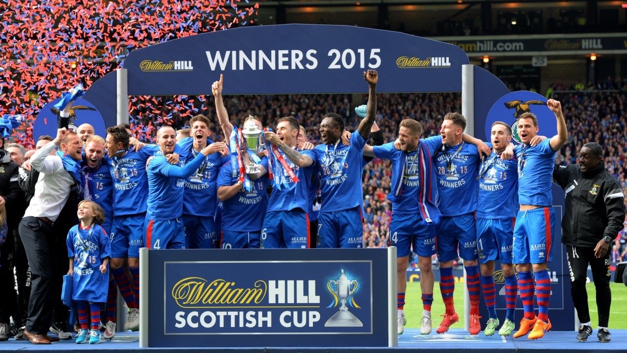 Now you see them... The Caley Thistle players celebrate with the Scottish Cup. Picture by Kenny Elrick