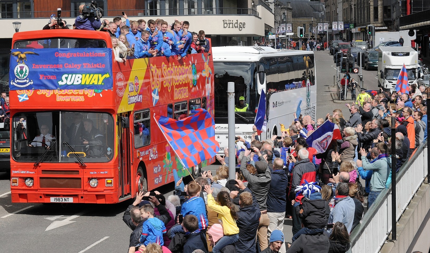 Caley Thistle players tour the city in an open top bus after their historic cup win