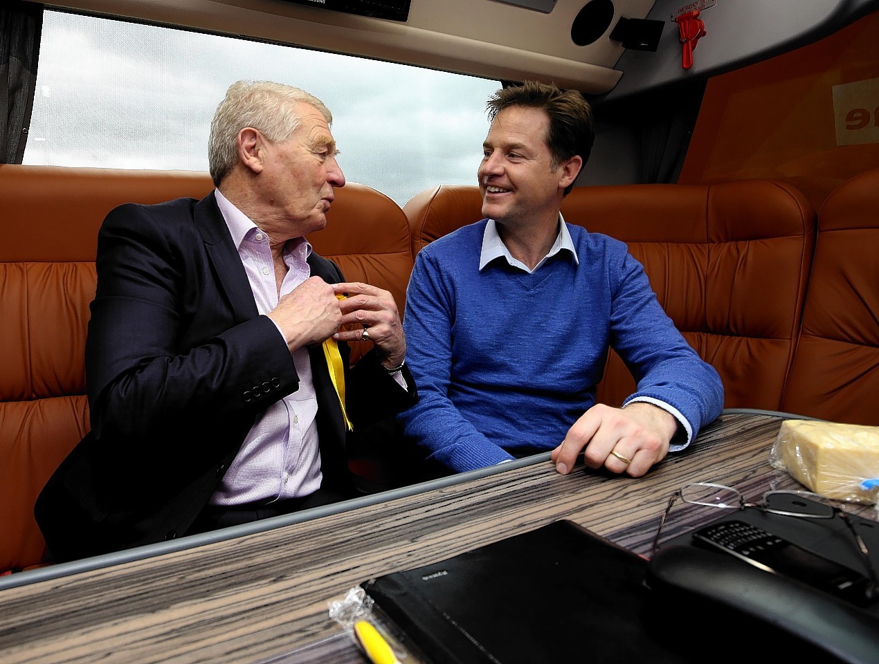 Liberal Democrats leader Nick Clegg talks with Lord Ashdown, Chair of the Liberal Democrats 2015 General Election Team, onboard the battle bus near Taunton, Sommerset