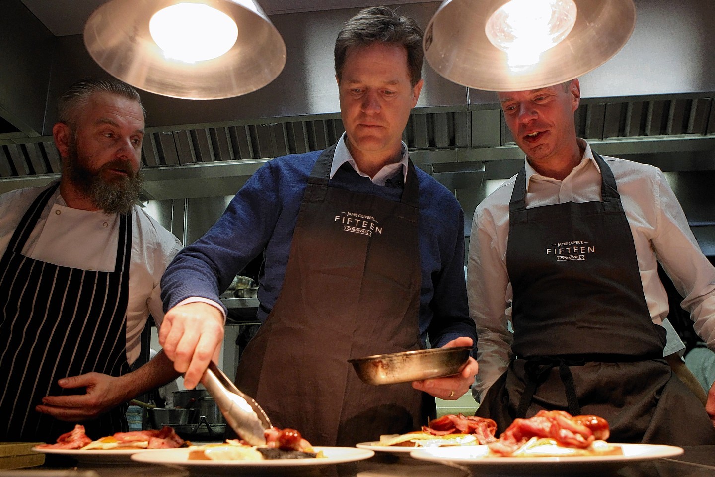 Liberal Democrats Party leader Nick Clegg  serves breakfast at Jamie Oliver's Fiftheen restaurant in Newquay, Cornwall