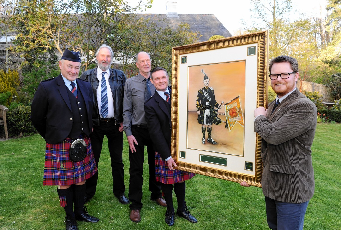 Gus McAskill presents the commissioned painting of Pipe Major George McLennan to curator Jesper Ericcson