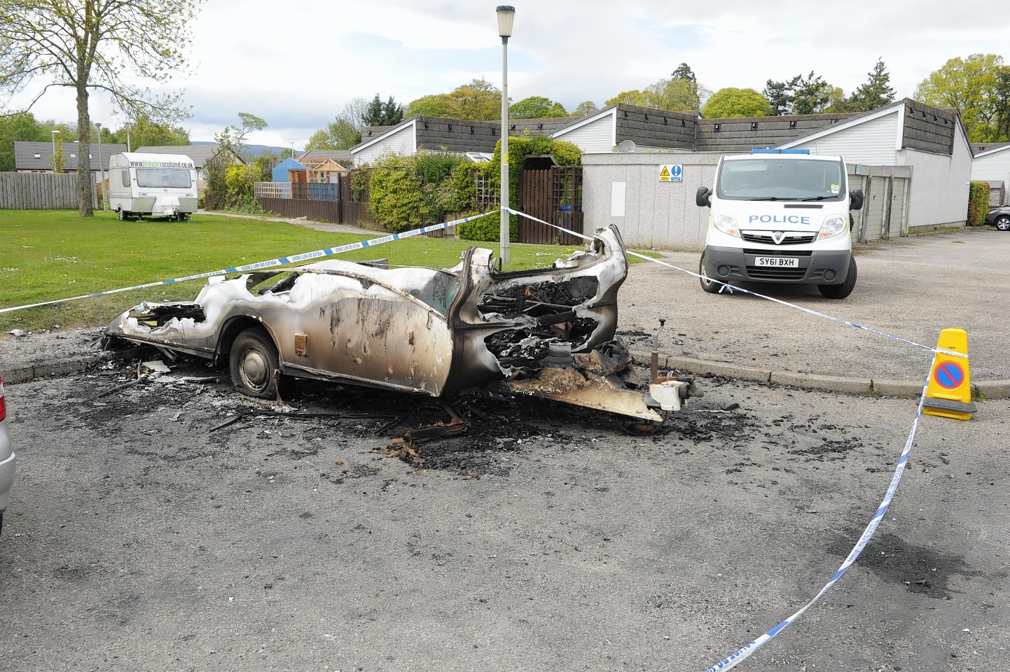 The burnt out remains of the caravan at Caberfeidh Drive, Invergordon