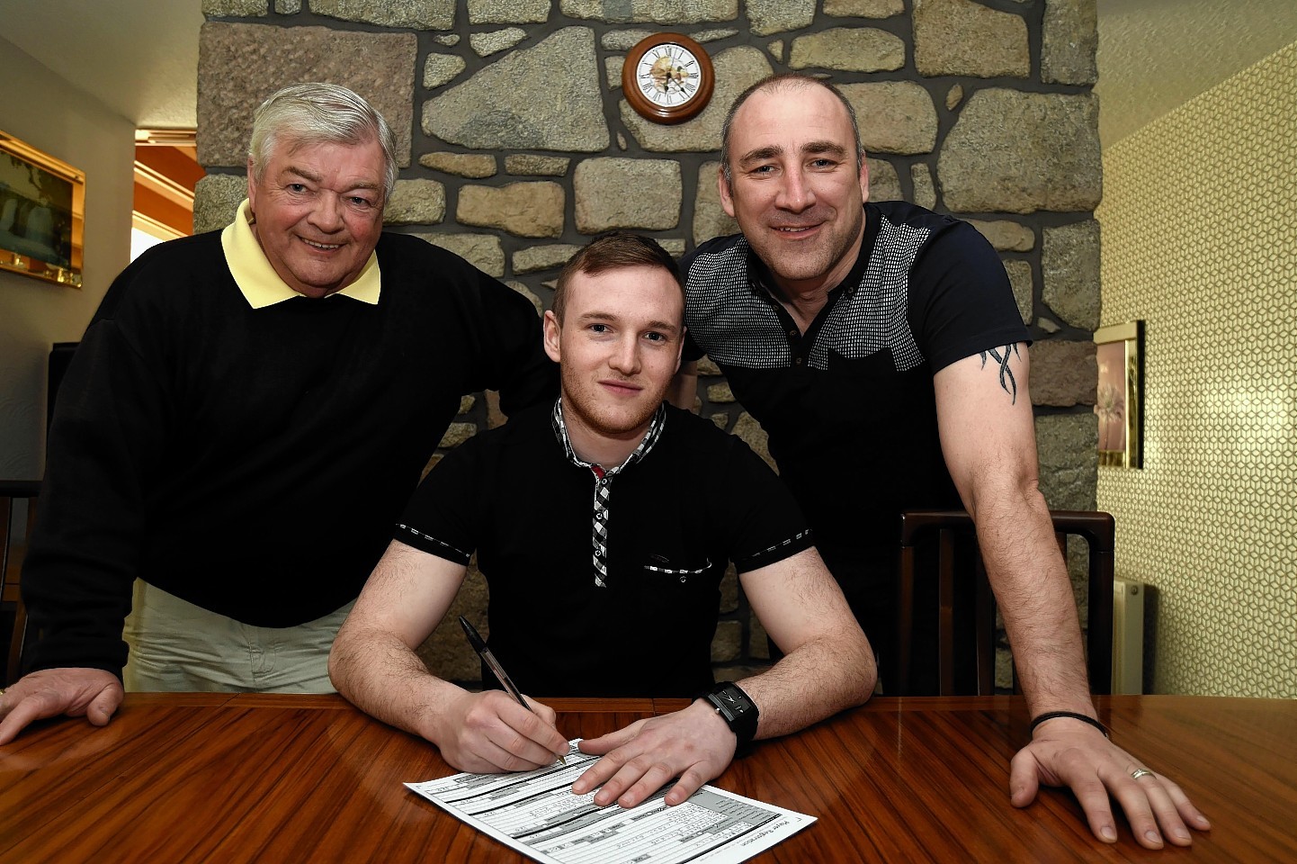 New signing James Duguid puts pen to paper