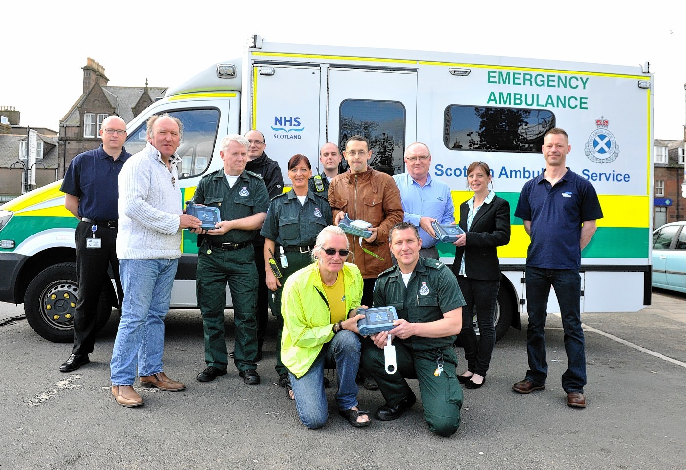 Stonehaven Community Council are receiving four defibrillators from Baker Hughes.
Pictured from back left to right are Martin Fisher (baker Hughes),  Community Vice Chair Phil Mills-Bishop, John McCullough (area manager Ambulance service south grampian),Loic Gauliard (baker Hughes), Sylvia Currid (technician),Fraser Wade (Technician), Council member Daniel Veltman, Jon Shaw (baker Hughes), Lynne Anderson (community member and owner of Maggie May's Coffee Shop) and John Trudgill (baker Hughes), Front left to right are David Harper (community council) and Nick Veitch