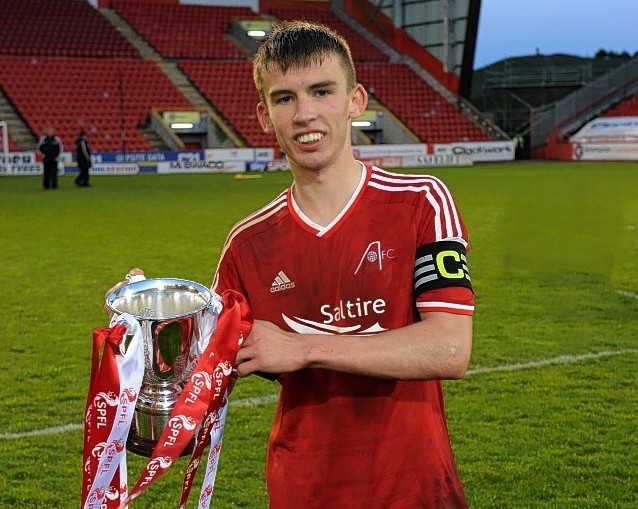 Kieran Gibbons celebrates the Dons under 20 success. Picture by Kenny Elrick