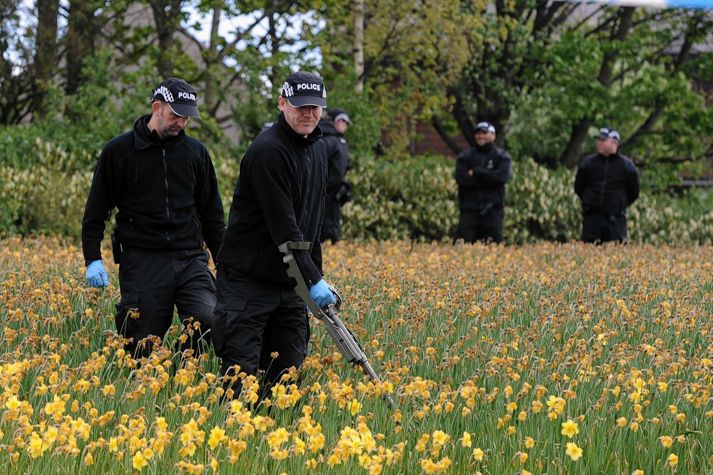 Police search the land at Nigg Way, Aberdeen. Picture by Kenny Elrick