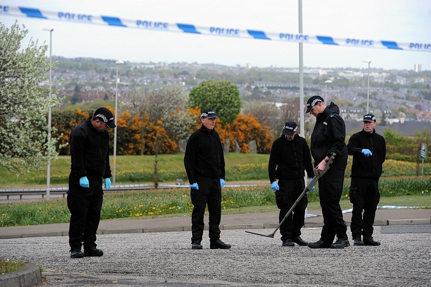 Police search the land at Nigg Way, Aberdeen. Picture by Kenny Elrick