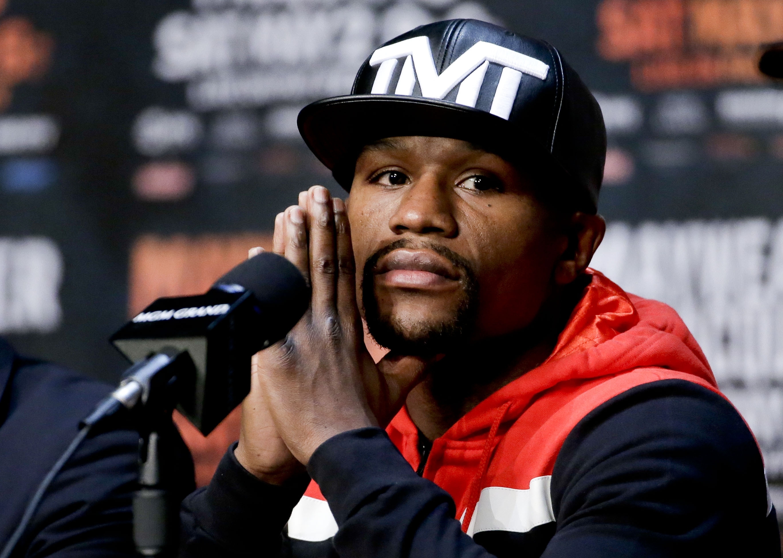 Floyd Mayweather Jr. listens during a pre-fight news conference in Las Vegas,