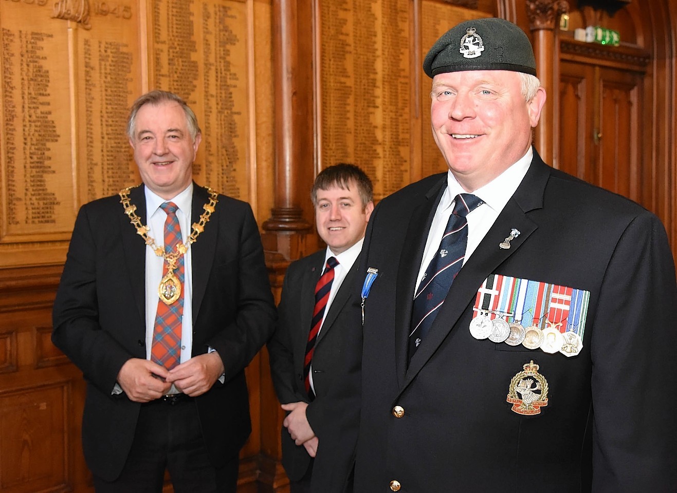 Michael Pretty of the Royal Newfoundland Regiment with Provost Alex Graham and Cllr Allan Duffy at Inverness Town House.