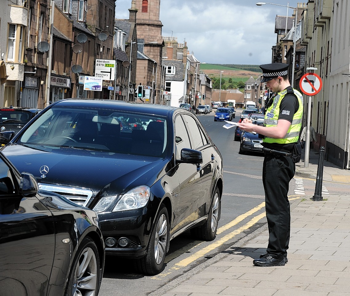 Constable Colin Logan patrolling Stonehaven as part of Operation Cedar