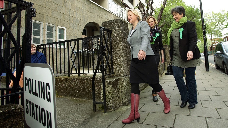 Green Party leader Natalie Bennett, left, arrives to cast her vote at Ossulston Tenants' Hall, London