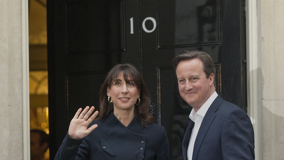 Prime Minister David Cameron and wife Samantha arrive at 10 Downing Street in central London