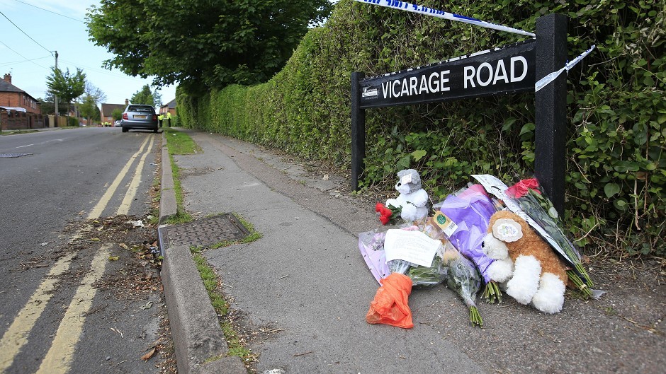 Floral tributes in Vicarage Roade, Didcot, Oxfordshire following the discovery of three bodies on Saturday night