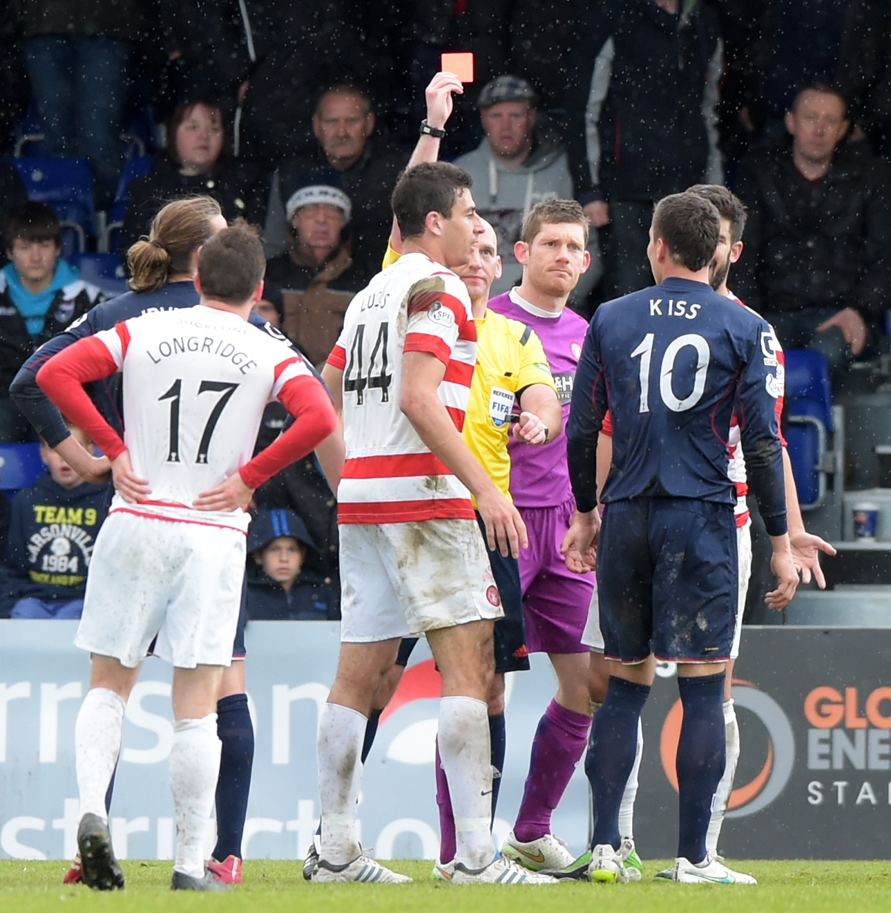 Filip Kiss is shown the red card by referee Bobby Madden