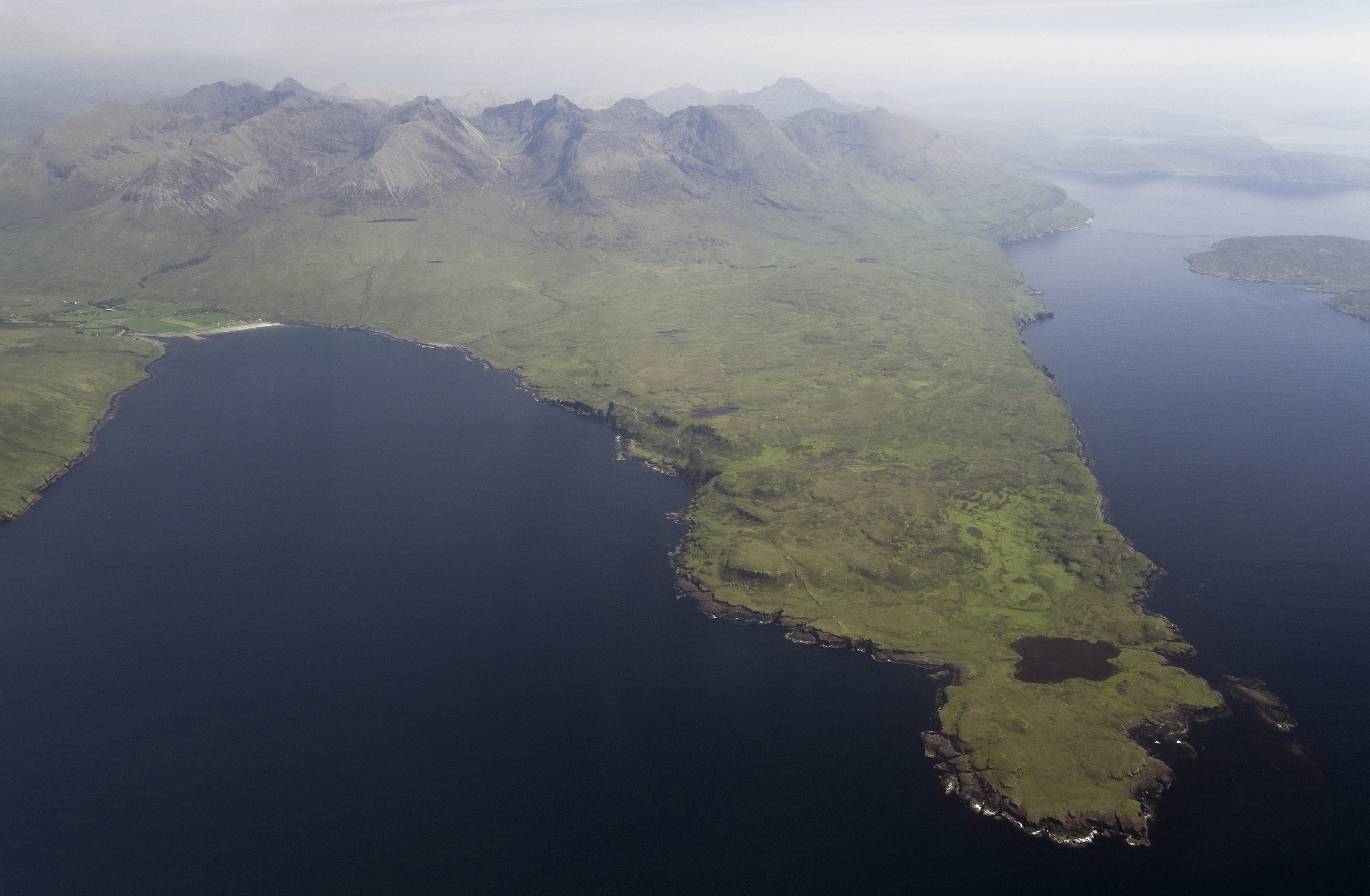 Rubh' an Dunain peninsula, Isle of Skye, showing at tip Clan MacAskill settlement and small loch connected to the sea by a man-made canal reputed to be of Viking origin.