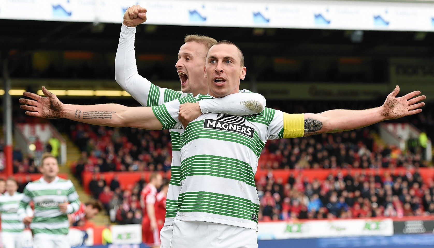 Celtic captain Scott Brown celebrates his goal against the Dons last season with team mate Leigh Griffiths.