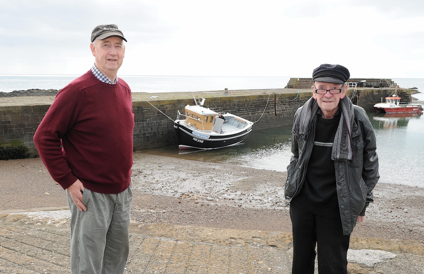 Johnshaven  man Tom Ritchie and Richard McBay with the Sea Venture for the first time in the water.
Picture by COLIN RENNIE