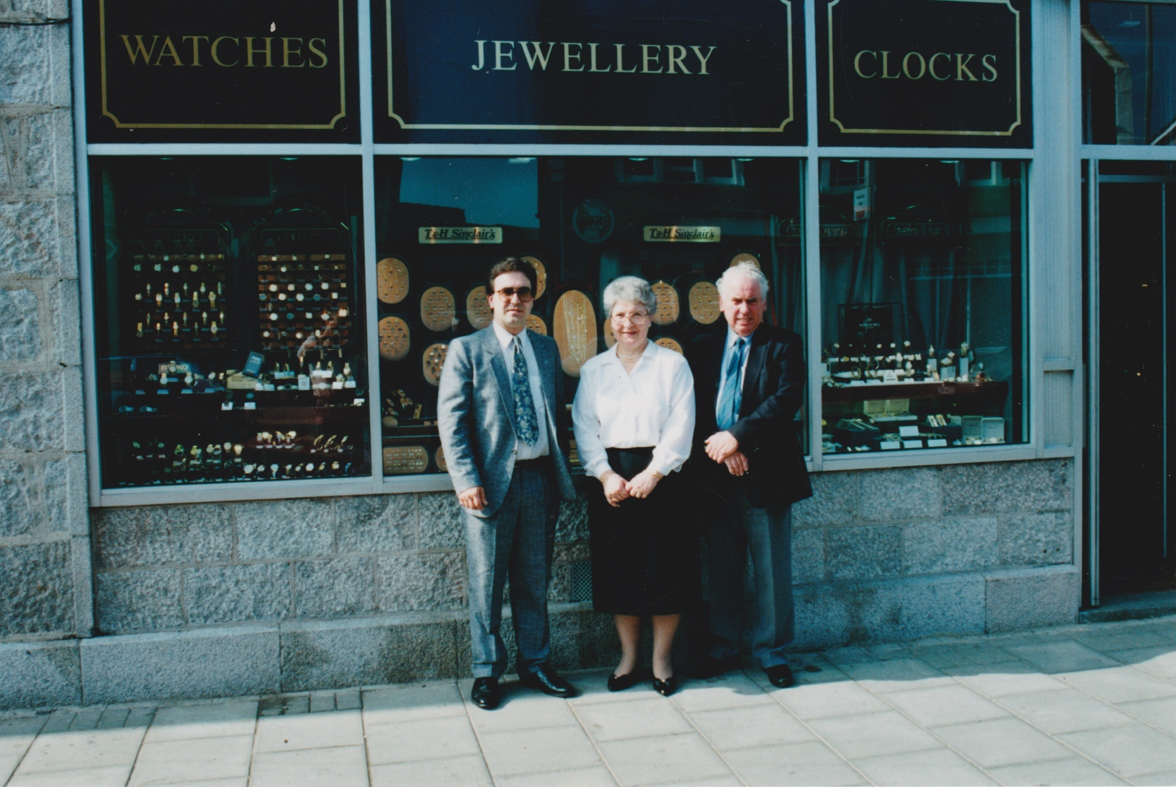 Ian Sinclair with his parents Helen and Tom outside the shop