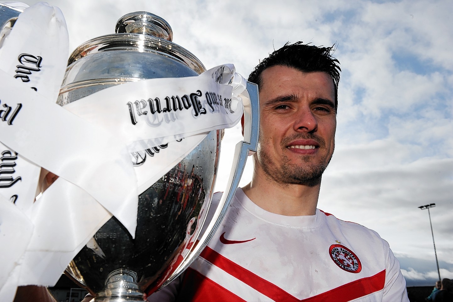 Steven Mackay celebrates with the Highland League trophy