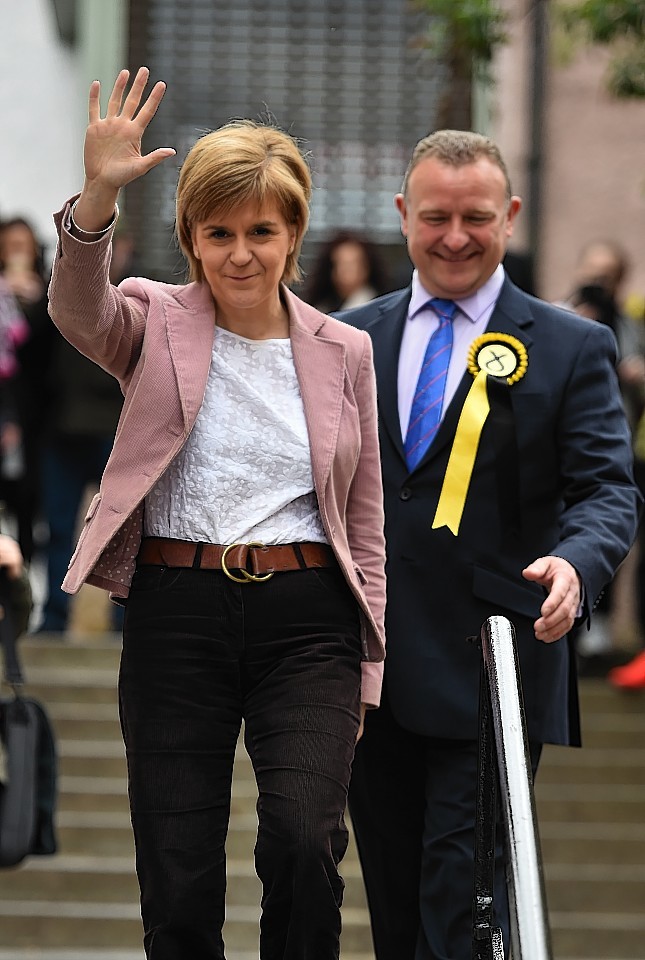 First Minister Nicola Sturgeon was greeted by SNP councillor and council leader Drew Hendry