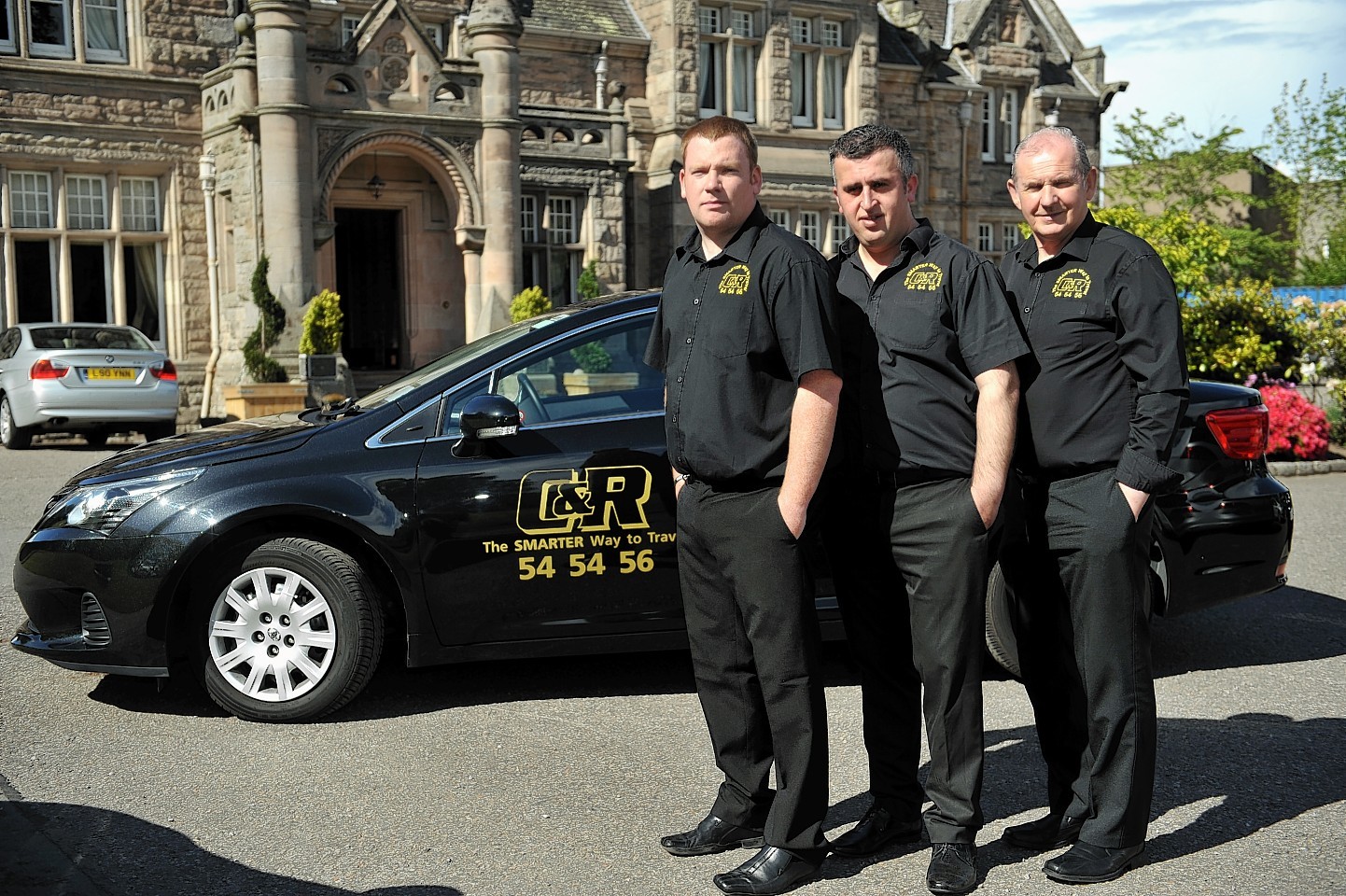 C&R Taxi drivers of Elgin, in their uniforms.