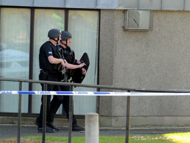 Police search the Kincorth Land flats last month.